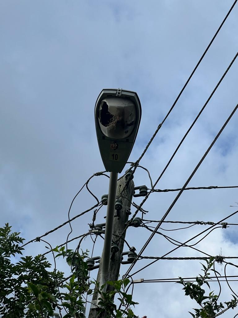 Broken JPS street light in corner district Jamaica.